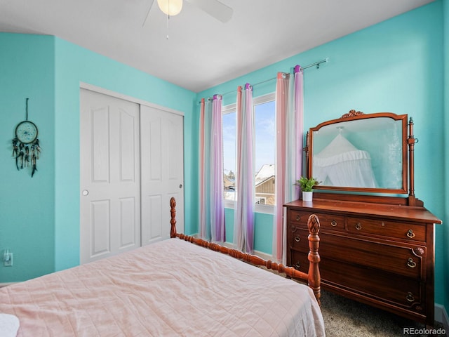 carpeted bedroom featuring a closet and ceiling fan