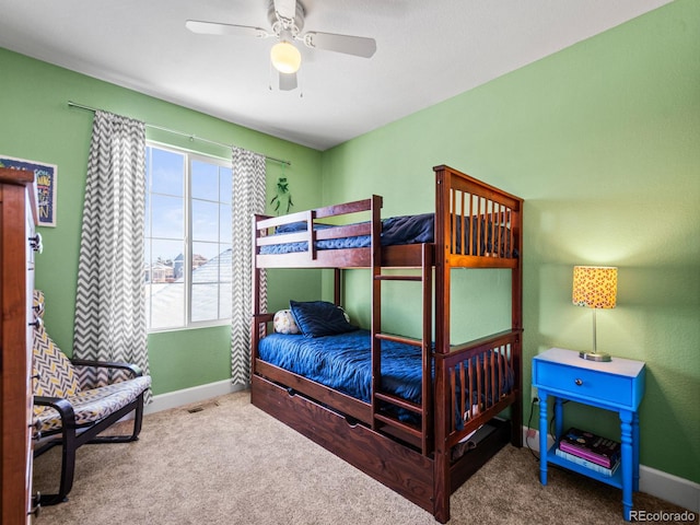 bedroom with ceiling fan and carpet flooring