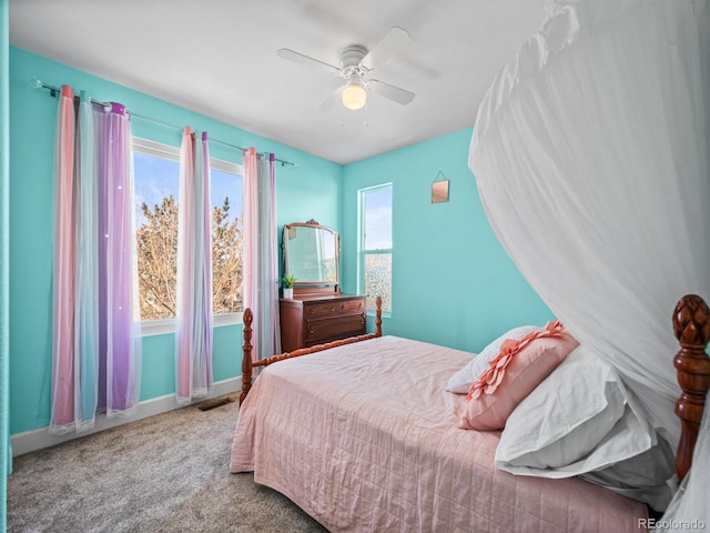 bedroom featuring light carpet and ceiling fan