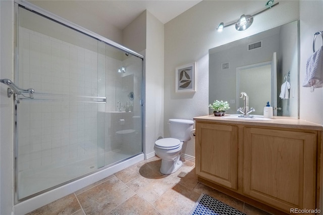 bathroom with an enclosed shower, vanity, and toilet