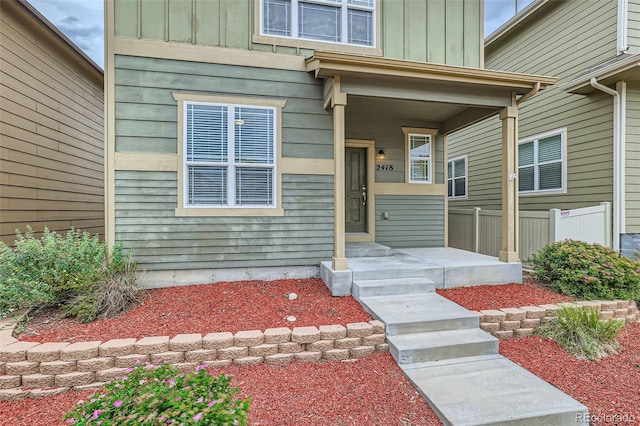 property entrance featuring a porch