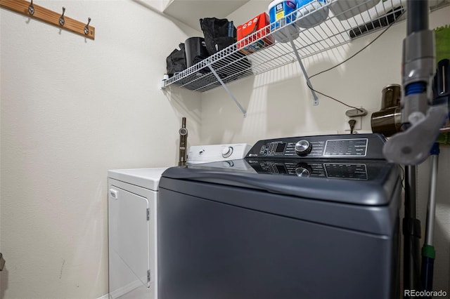 laundry room featuring laundry area and washer and clothes dryer