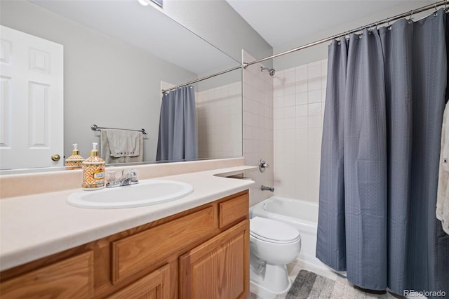 full bath with toilet, shower / bath combo, and vanity