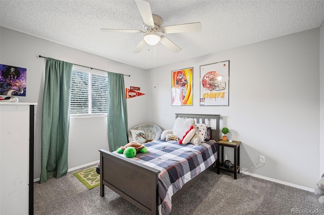 bedroom with carpet, baseboards, and a textured ceiling