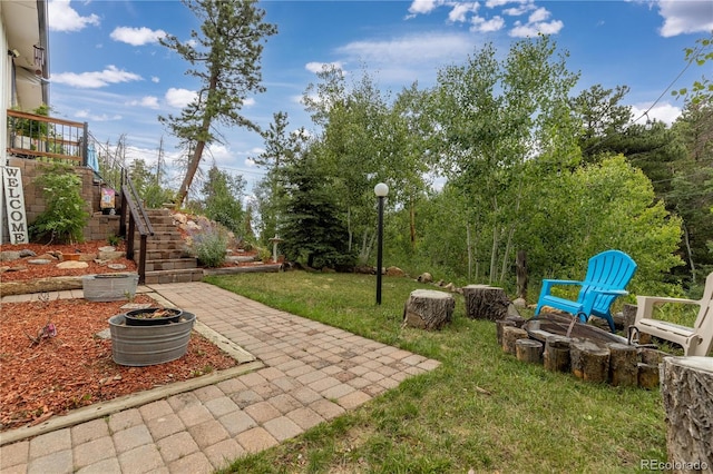 view of yard with stairs and a patio area