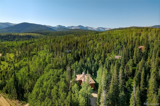 2246 Gcr 8, Fraser, CO 80442 - drone / aerial view of a heavily wooded area and a mountainous background