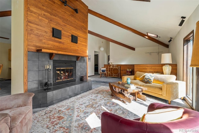 2246 Gcr 8, Fraser, CO 80442 - living area with a fireplace, carpet flooring, beam ceiling, and high vaulted ceiling