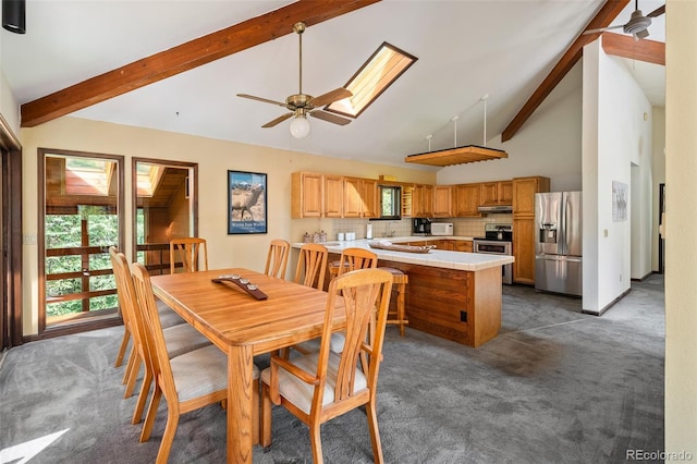 2246 Gcr 8, Fraser, CO 80442 - carpeted dining space with ceiling fan, beam ceiling, a skylight, and high vaulted ceiling