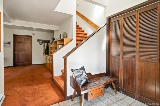 2246 Gcr 8, Fraser, CO 80442 - staircase with a baseboard heating unit and carpet