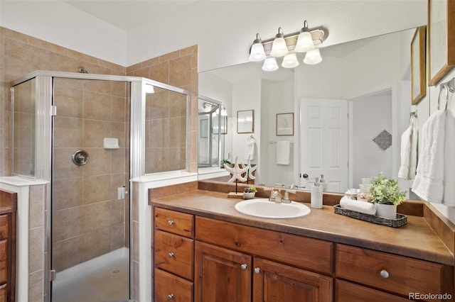 bathroom with vanity and an enclosed shower