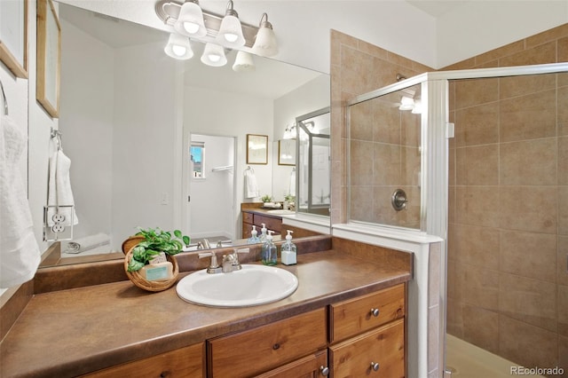 bathroom with vanity and an enclosed shower