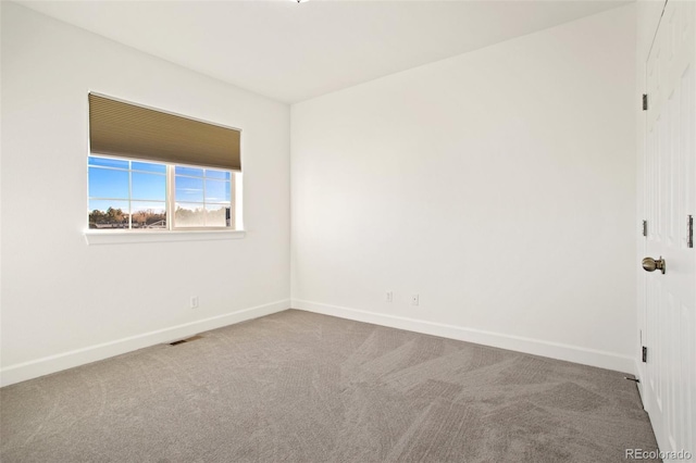 unfurnished room featuring carpet flooring