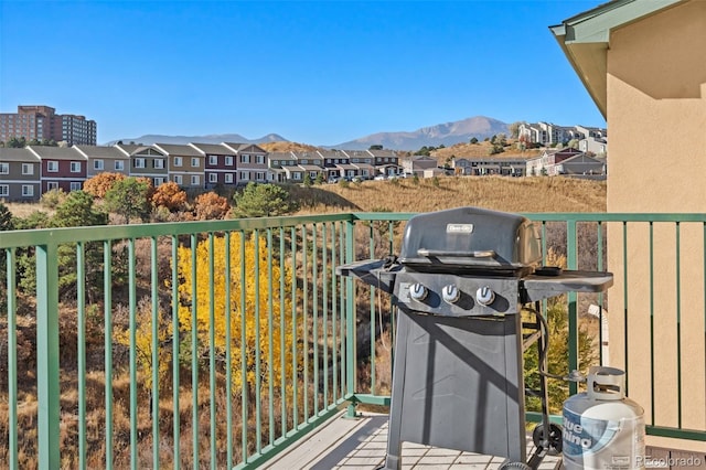 balcony with a grill and a mountain view