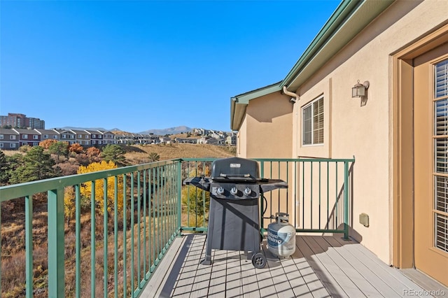 balcony featuring a mountain view and area for grilling