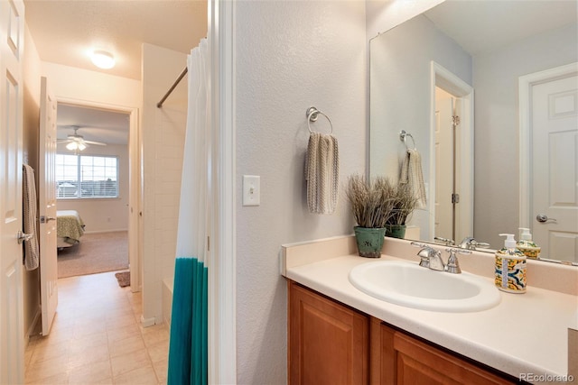 ensuite bathroom with vanity, a shower with shower curtain, and ceiling fan