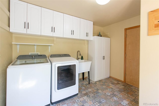 426 S San Juan Ave, Buena Vista, CO 81211 - laundry area with washing machine and dryer, cabinet space, baseboards, and tile patterned floors
