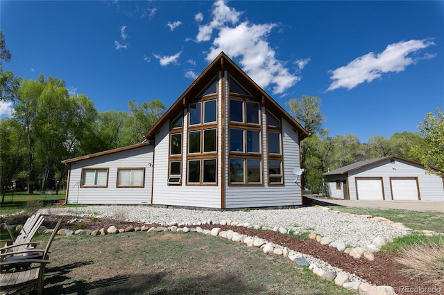 426 S San Juan Ave, Buena Vista, CO 81211 - view of home's exterior featuring a detached garage and an outbuilding