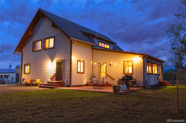 426 S San Juan Ave, Buena Vista, CO 81211 - back of property with a yard and a patio area
