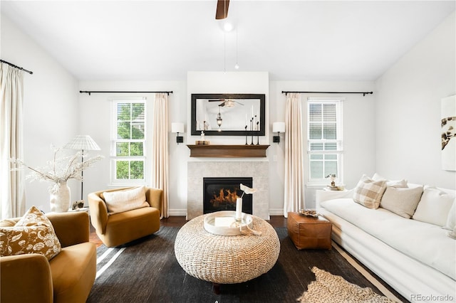 3320 Yukon Ct, Wheat Ridge, CO 80033 - living room featuring a tile fireplace, wood finished floors, ceiling fan, vaulted ceiling, and baseboards