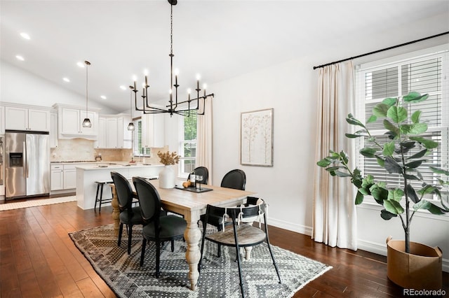3320 Yukon Ct, Wheat Ridge, CO 80033 - dining room featuring a chandelier, dark wood-style floors, lofted ceiling, baseboards, and recessed lighting
