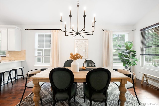 3320 Yukon Ct, Wheat Ridge, CO 80033 - dining space with a chandelier, dark wood-style flooring, and baseboards