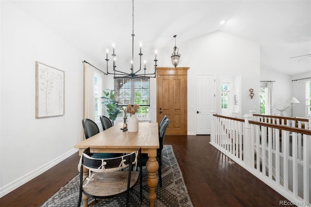 3320 Yukon Ct, Wheat Ridge, CO 80033 - dining area with a chandelier, lofted ceiling, dark wood-style floors, and baseboards