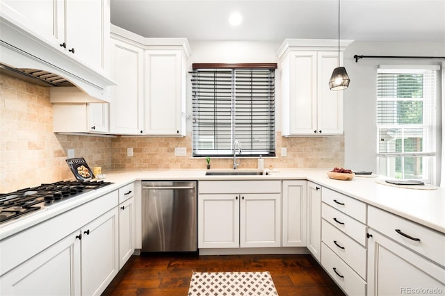 3320 Yukon Ct, Wheat Ridge, CO 80033 - kitchen with dishwasher, a sink, custom exhaust hood, white cabinetry, and dark wood-style flooring
