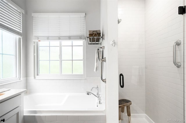 3320 Yukon Ct, Wheat Ridge, CO 80033 - bathroom with a garden tub, a stall shower, and vanity