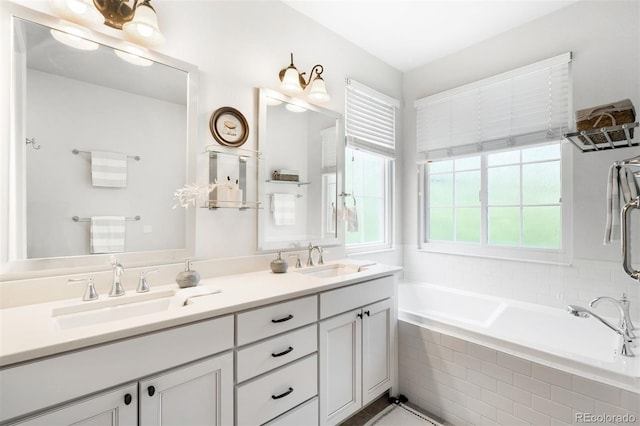 3320 Yukon Ct, Wheat Ridge, CO 80033 - bathroom featuring a garden tub and double vanity