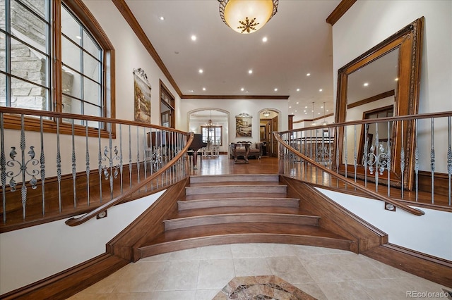 staircase featuring tile patterned flooring, ornamental molding, and recessed lighting