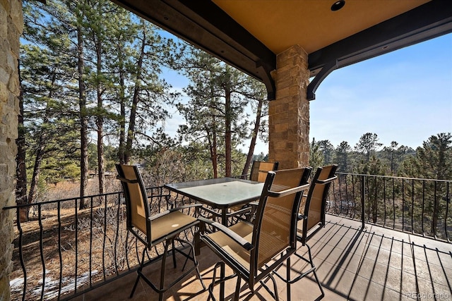 wooden terrace with outdoor dining area