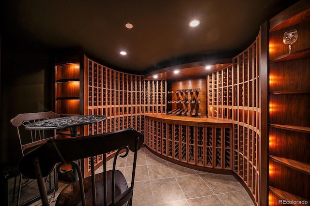 wine cellar featuring tile patterned flooring and recessed lighting