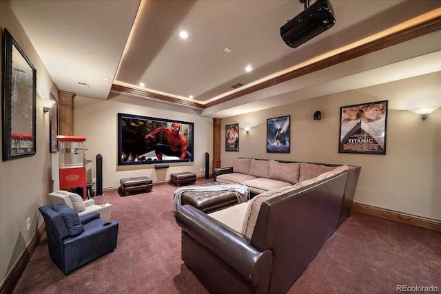 carpeted home theater room with recessed lighting, a raised ceiling, visible vents, and baseboards