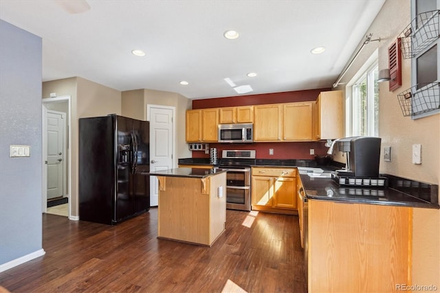 13818 Krameria St, Thornton, CO 80602 - kitchen featuring dark wood-style flooring, a center island, dark countertops, and appliances with stainless steel finishes