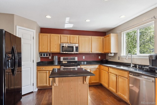 13818 Krameria St, Thornton, CO 80602 - kitchen with dark wood-style flooring, dark countertops, stainless steel appliances, and a sink