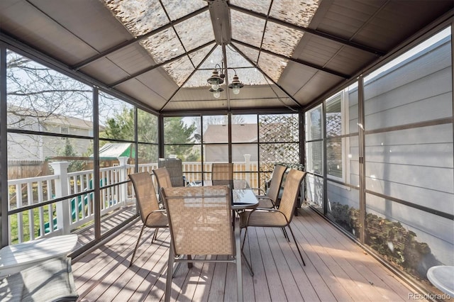13818 Krameria St, Thornton, CO 80602 - sunroom with a healthy amount of sunlight, a chandelier, and outdoor dining space