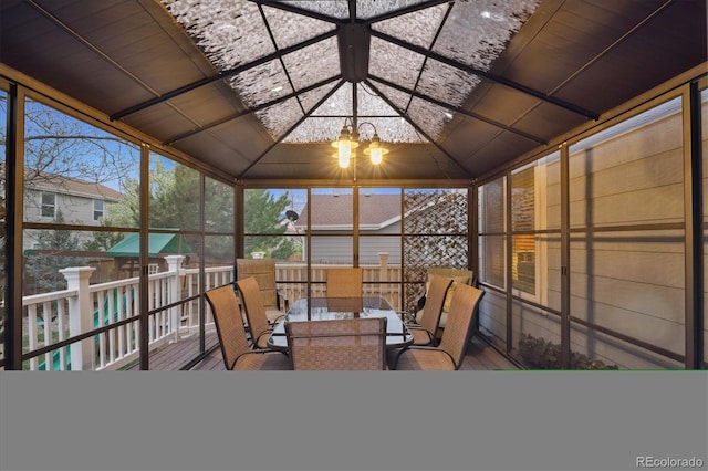 13818 Krameria St, Thornton, CO 80602 - sunroom / solarium with vaulted ceiling, outdoor dining space, a deck, floor to ceiling windows, and a chandelier