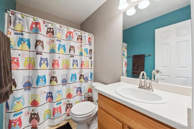 13818 Krameria St, Thornton, CO 80602 - full bathroom featuring toilet, curtained shower, vanity, and a textured wall