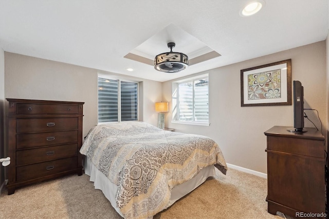 13818 Krameria St, Thornton, CO 80602 - bedroom with baseboards, a tray ceiling, recessed lighting, and light colored carpet