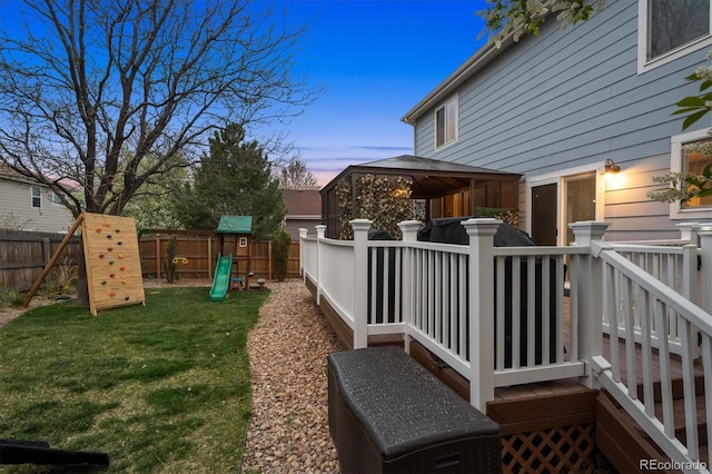 13818 Krameria St, Thornton, CO 80602 - view of yard featuring a fenced backyard, a gazebo, a deck, and a playground