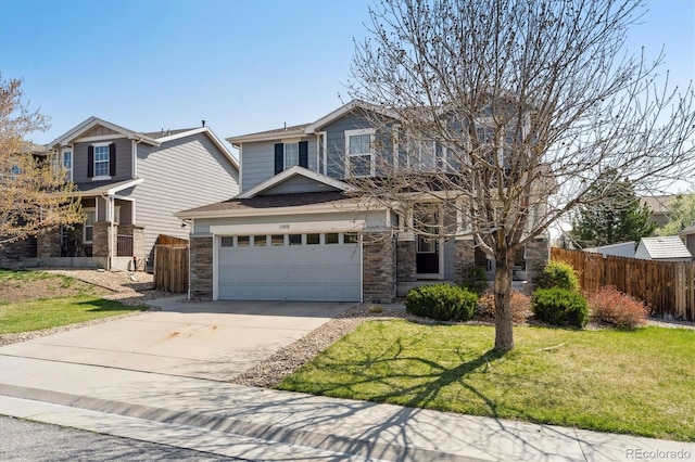 13818 Krameria St, Thornton, CO 80602 - view of front of home with stone siding, driveway, fence, and a garage