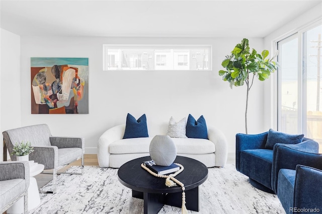 living room featuring wood finished floors and baseboards