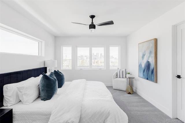 bedroom with carpet flooring, ceiling fan, and baseboards