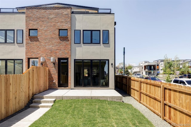 back of property featuring stucco siding and a patio area
