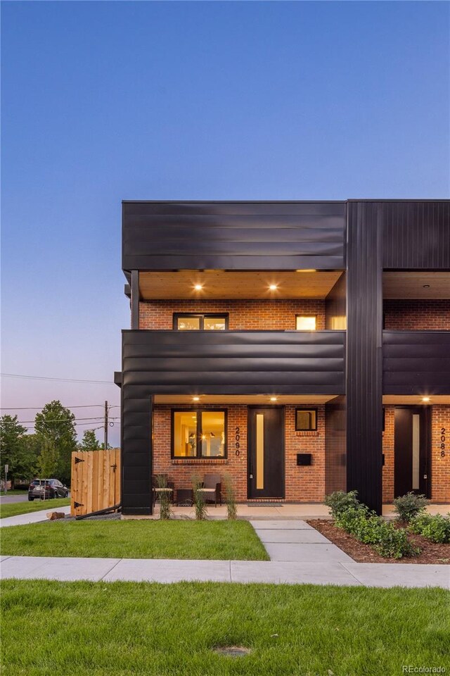 2090 Eliot St, Denver, CO 80211 - modern home with brick siding and a front yard