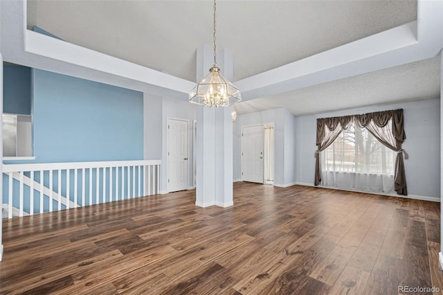 interior space with hardwood / wood-style floors and a chandelier