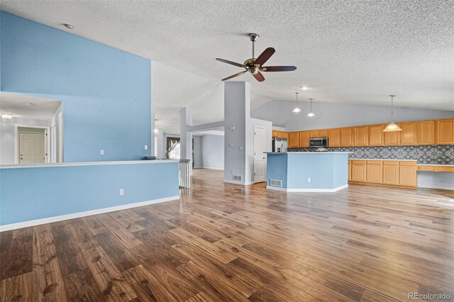 unfurnished living room with light wood-type flooring, ceiling fan, and high vaulted ceiling