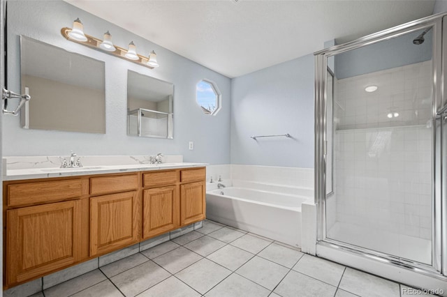 bathroom featuring tile patterned floors, separate shower and tub, and vanity