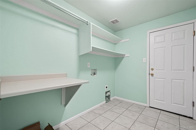 laundry room featuring light tile patterned flooring, hookup for a washing machine, and electric dryer hookup