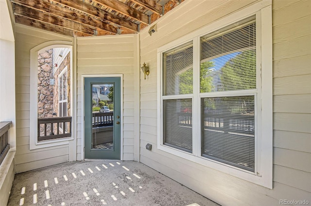 property entrance with covered porch